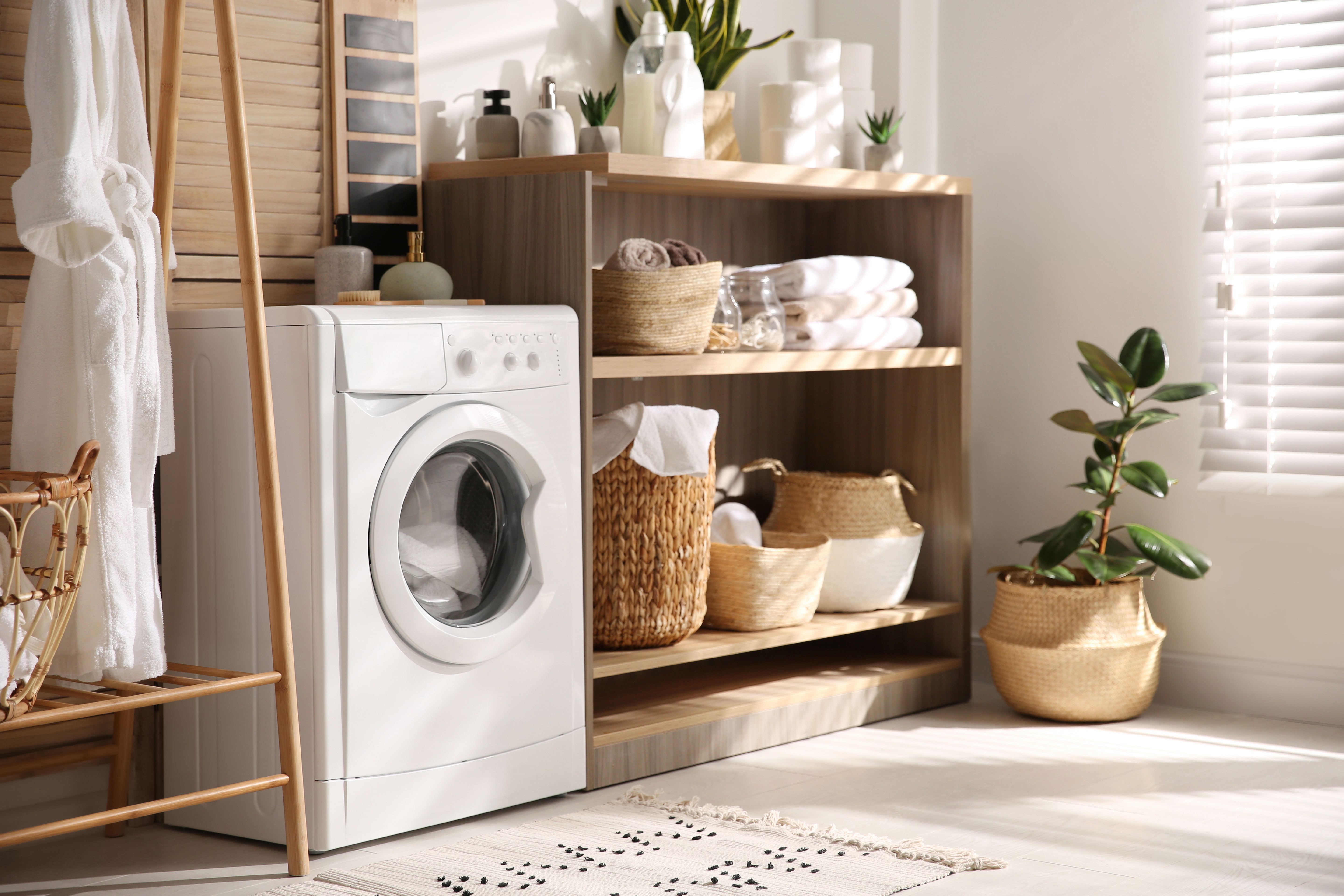 Very well organized laundry room washing machine clothes.jpg