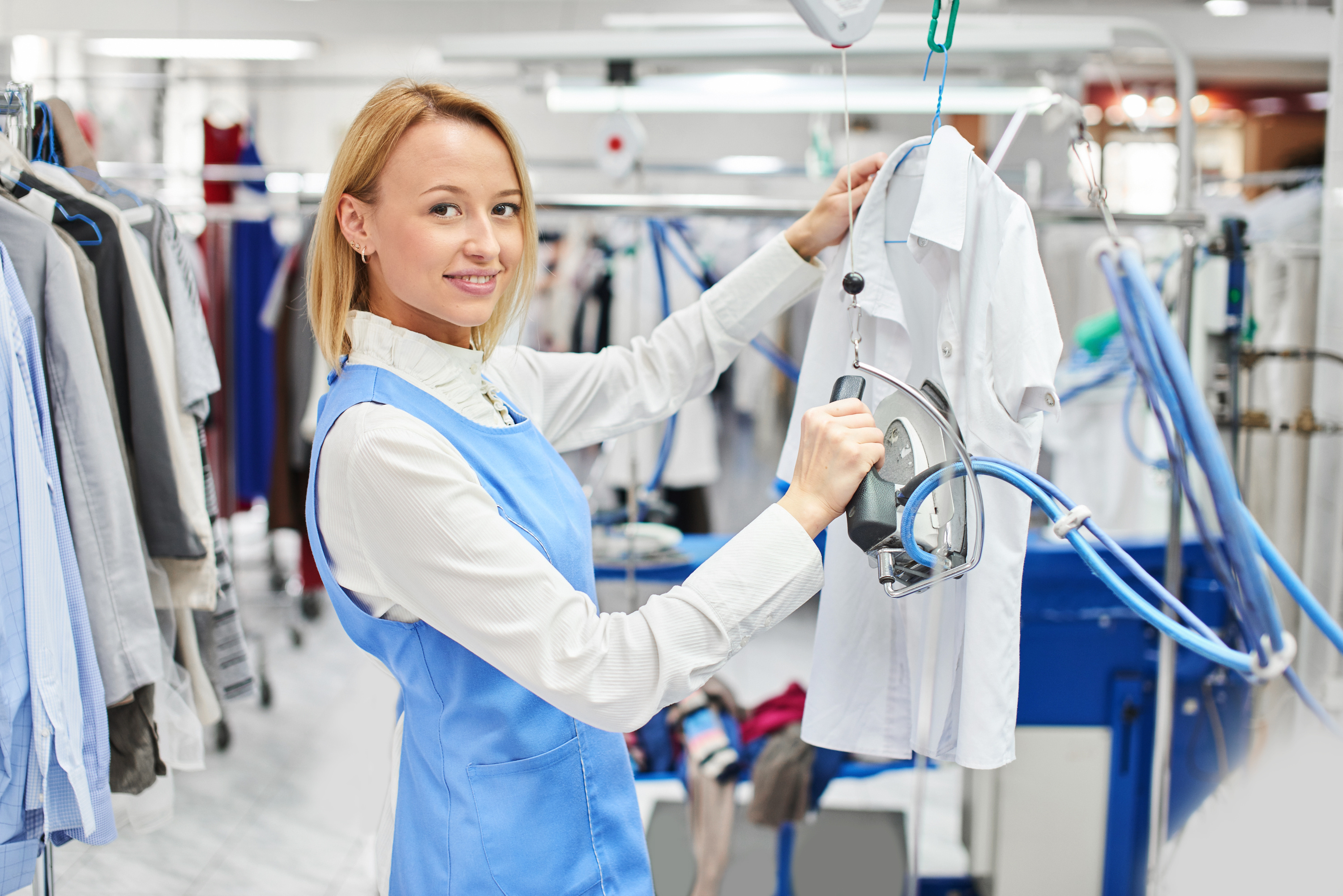 Woman ironing shirt dry cleaning wash and fold.jpg