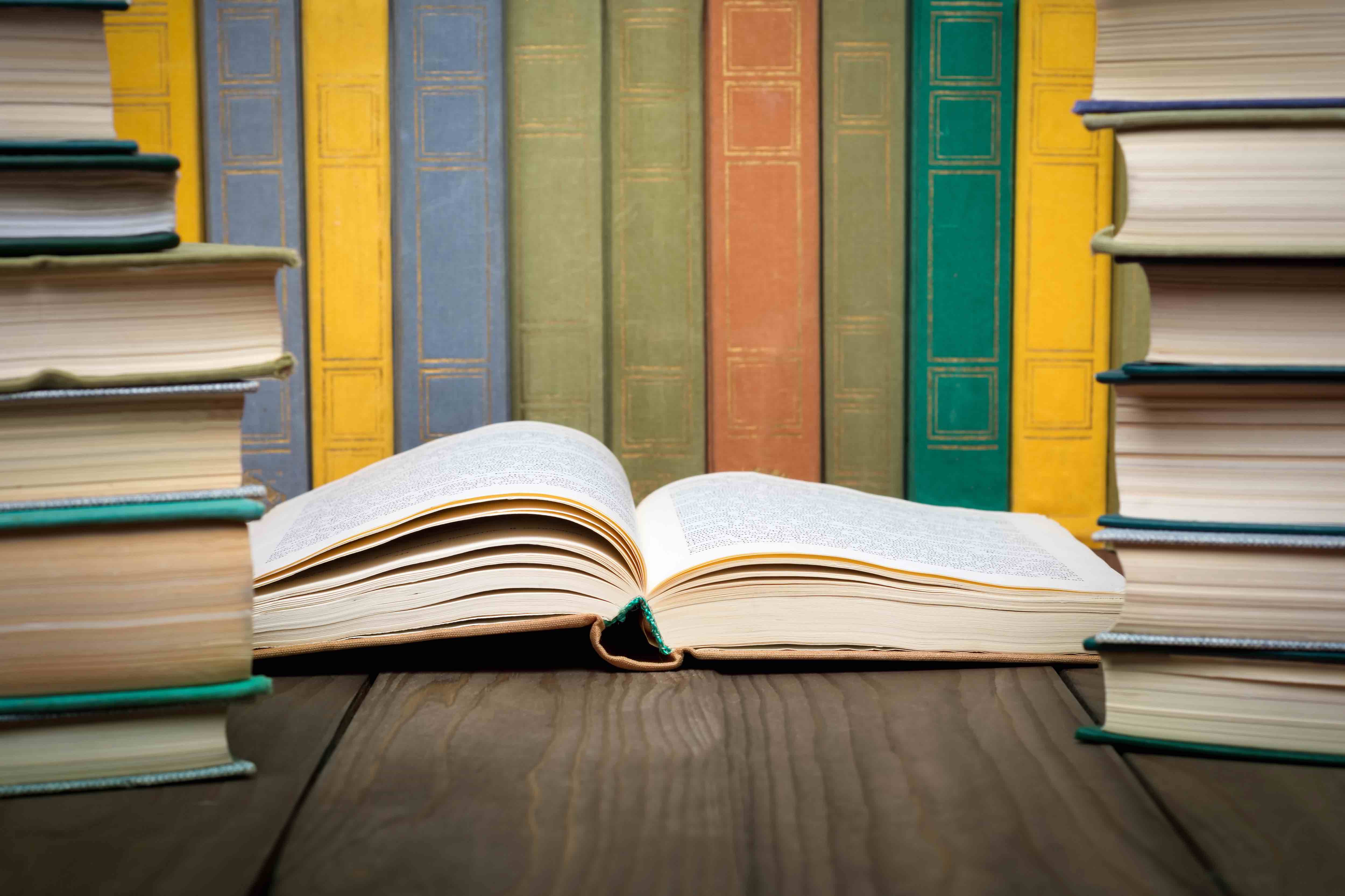 Open book in a stack of laundry books.jpg