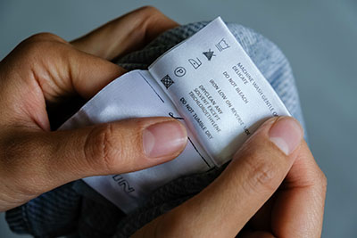Woman reading clothing label instructions.jpg